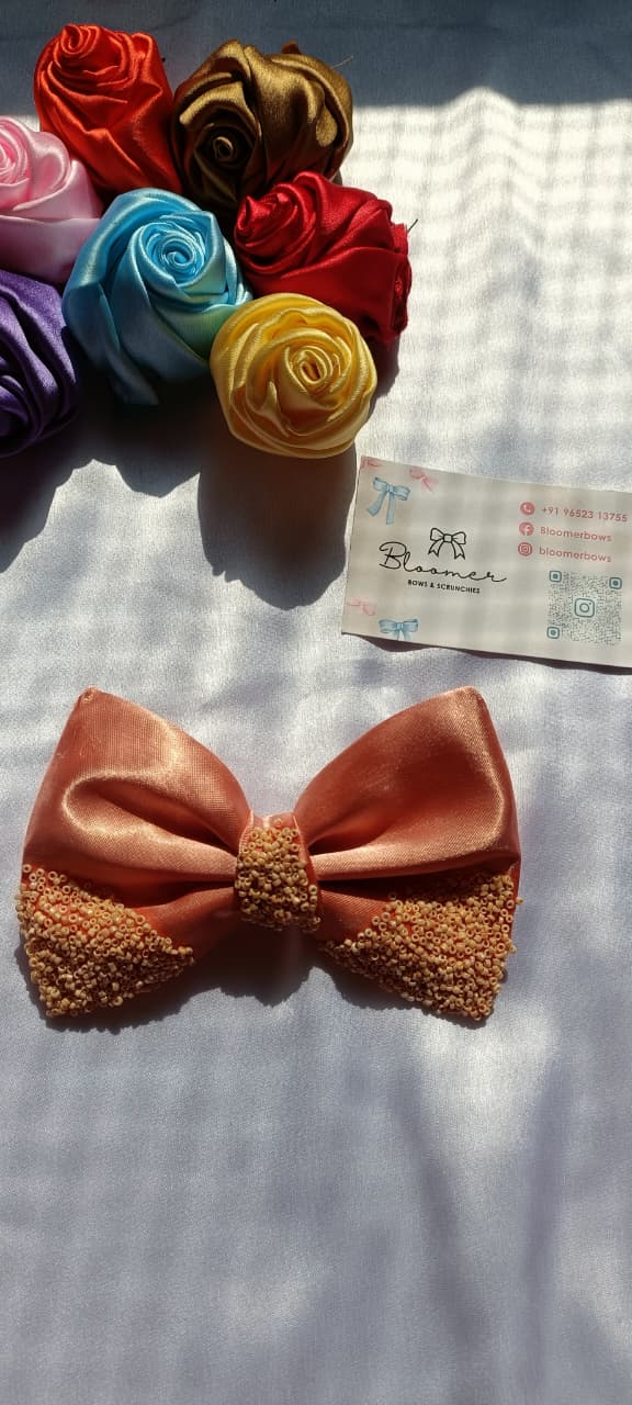 Traditional peach colour bows with cream besds